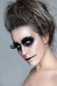 61289620 - woman with stylish fancy gothic halloween make-up and hairdo